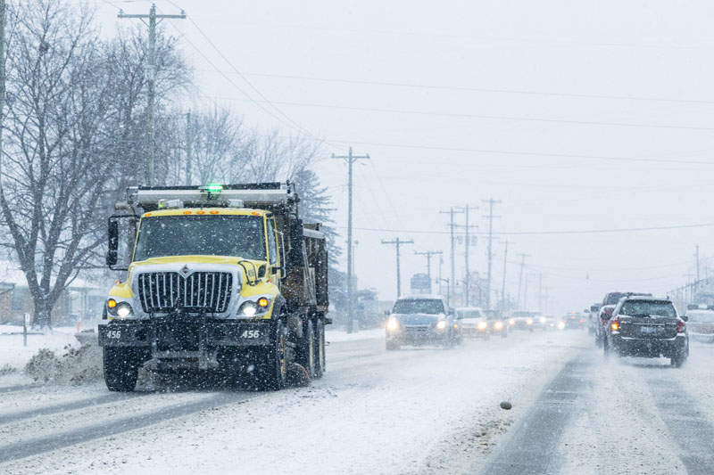 Powerful winter storm dumps heavy snow, causing flight delays, slick ...